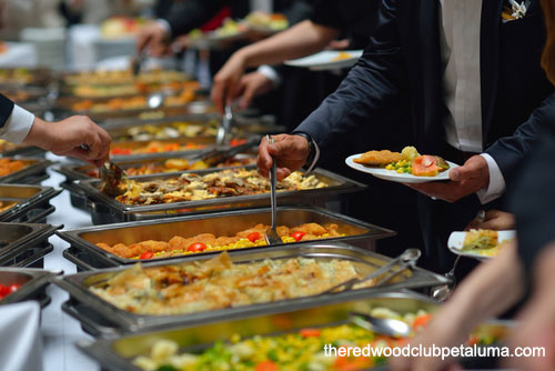 People Serving Themselves at a Buffet